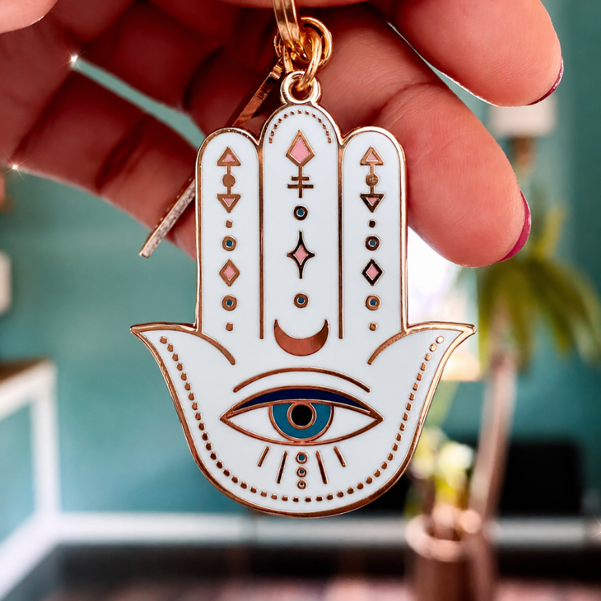 HAMSA DOUBLE-SIDED ENAMEL KEYCHAIN IN GOLD, BLUE & WHITE