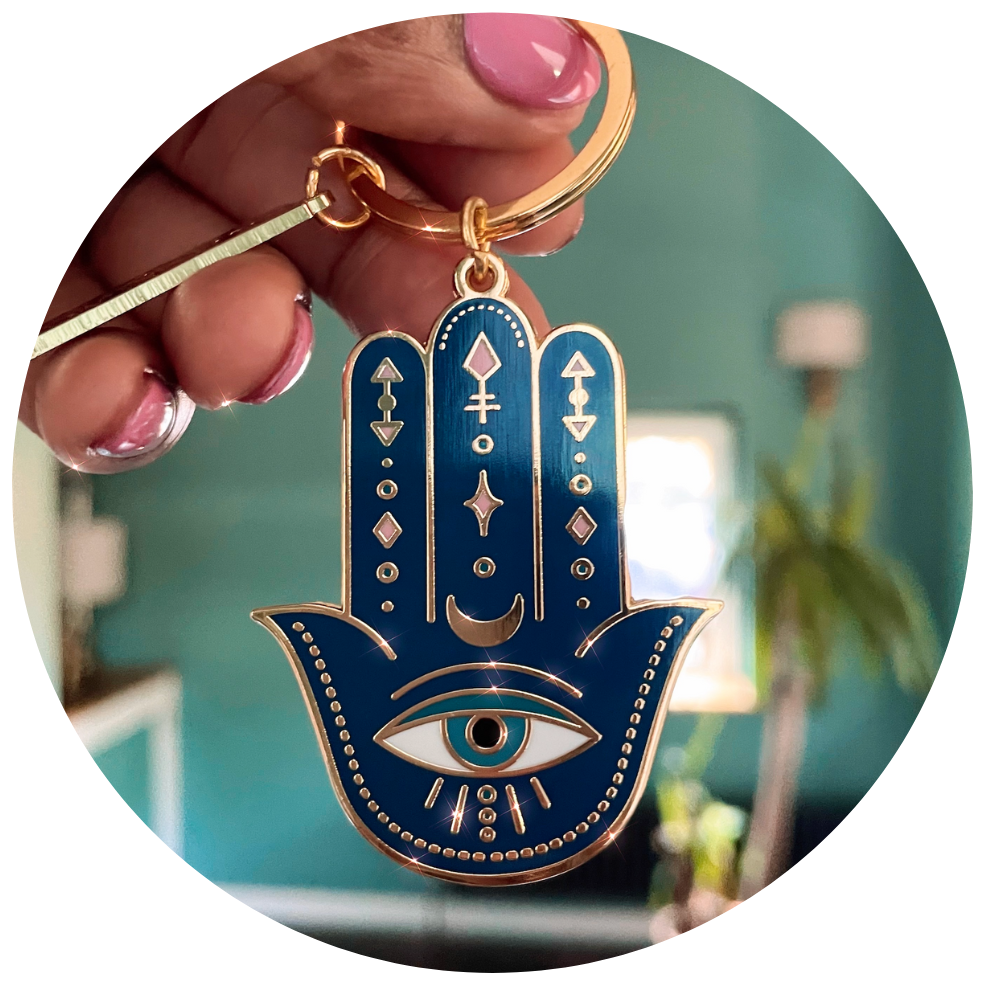 HAMSA DOUBLE-SIDED ENAMEL KEYCHAIN IN GOLD, BLUE & WHITE HAMSA DOUBLE-SIDED ENAMEL KEYCHAIN IN GOLD, BLUE & WHITE